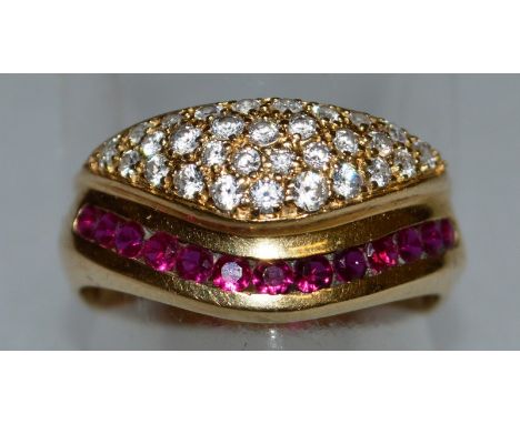 AN 18CT GOLD FANCY DIAMOND AND RUBY RING.