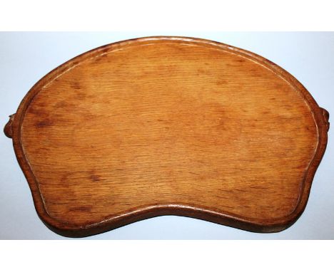 A MOUSEMAN SHAPED CHEESE DISH, the edges carved with two mice. 18ins long, 13ins wide.