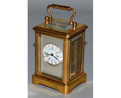 A GOOD BRASS MINIATURE CARRIAGE CLOCK. 2.25ins high.