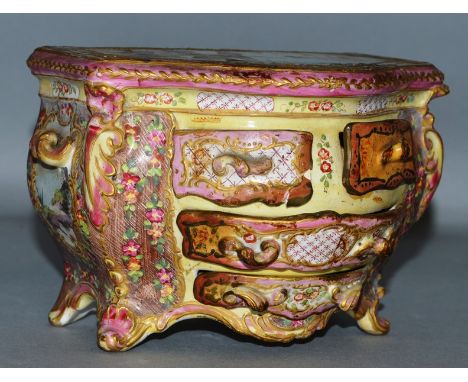A SMALL CONTINENTAL PORCELAIN SERPENTINE FRONTED COMMODE, the top painted with a fox looking at a sheep.  5.5ins wide, 4ins h