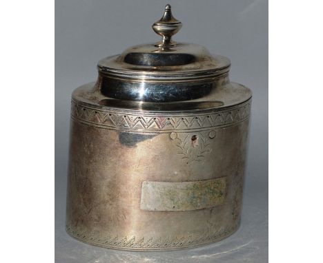 A GEORGE III OVAL TEA CADDY AND COVER with engraved decoration.London 1787.  Maker W.P.  Weight 15ozs.