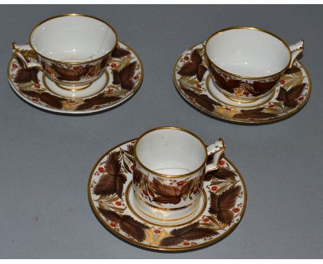 TWO TEACUPS, A COFFEE CAN AND THREE SAUCERS with brown leaf, some a/f impress BFB.
