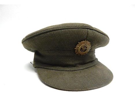 AN IRISH FREE STATE ARMY PEAKED CLOTH CAP  bearing brass cap badge.