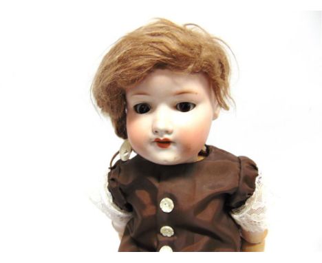AN ARMAND MARSEILLE BISQUE SOCKET-HEAD DOLL with a plaited light brown wig, sleeping brown glass eyes, and an open mouth with