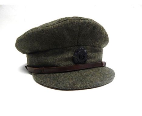 AN IRISH FREE STATE ARMY SOFT PEAKED CLOTH CAP  by Jonathan Richards & Co. of Dublin, complete with leather liner bearing mak