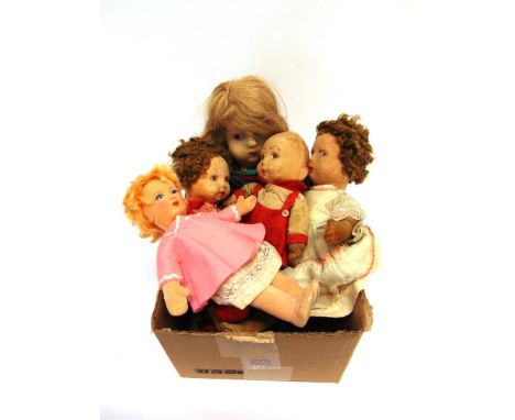 A FELTED CLOTH GIRL DOLL with blonde hair, and painted facial features with side-glancing eyes, on a jointed body, fully dres