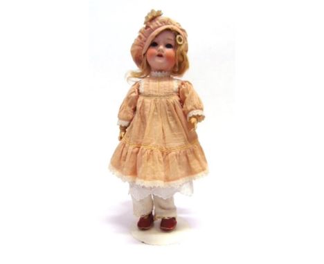 AN ARMAND MARSEILLE BISQUE SOCKET-HEAD DOLL with a blonde wig, sleeping blue glass eyes, and an open mouth with four upper te
