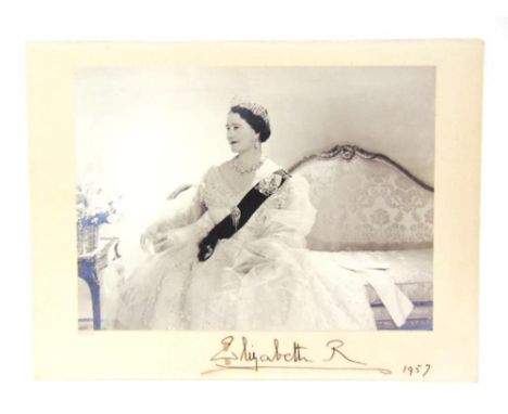 QUEEN ELIZABETH THE QUEEN MOTHER (1900-2002) A black and white portrait photograph by Cecil Beaton, the subject seated and gl