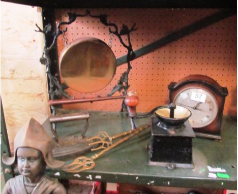 A clock, coffee grinder, fire set and gong et cetera