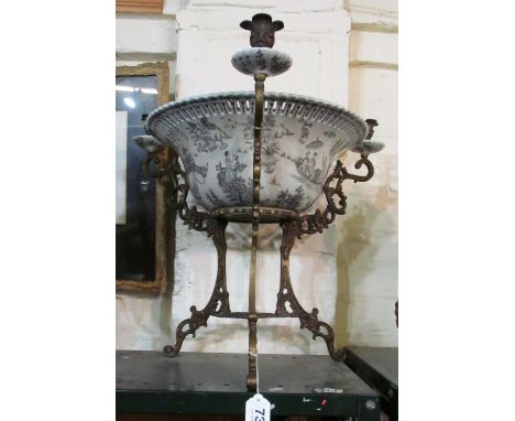 A 19th Century blue and white perforated wash basin on brass stand