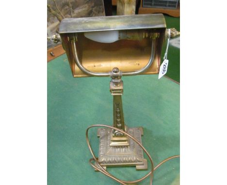 A brass desk lamp