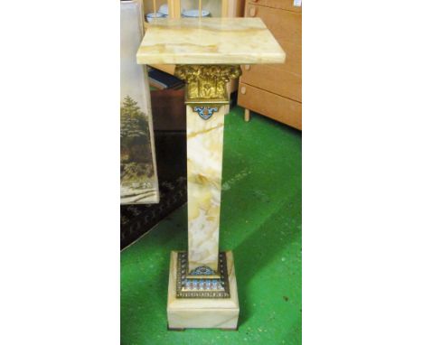 An onyx torchere with gilt mounts and enamel decoration