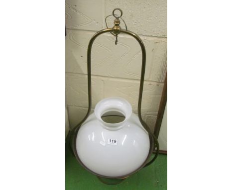 A brass hanging paraffin lamp with white shade, electrified