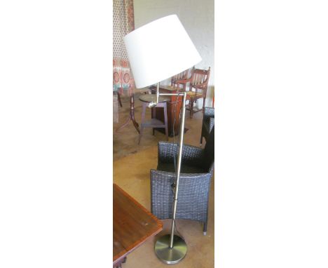 A standard lamp with reading light