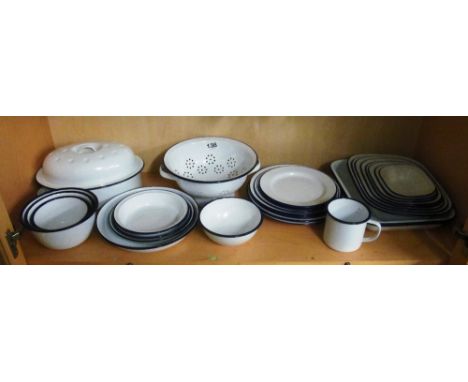 A set of white enamel pie dishes and other dishes