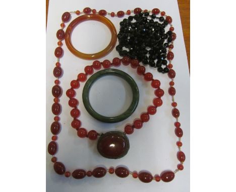 A jade bangle and other items