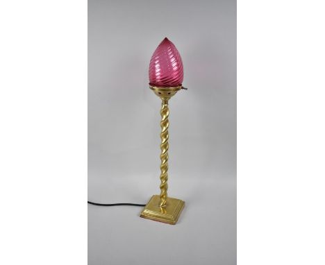 An Edwardian Brass Barley Twist Table Lamp with Cranberry Glass Shade, 68cms High 