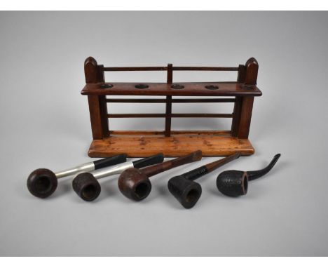 An Edwardian Mahogany Pipe Stand in the Form of a Five Bar Gate together with Four Vintage Pipes, 26cms Long 