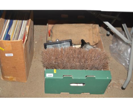 A box containing brush head, tools, bulk head light etc.