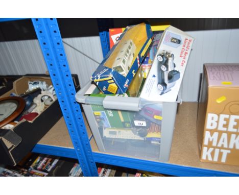 A box of children's toys, boxed children's toys including a "John Deere" tractor