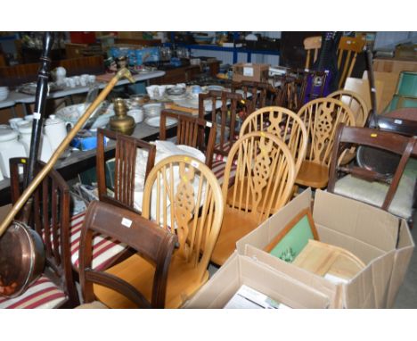 A set of beechwood stick and wheel back dining chairs and another stick back dining chair