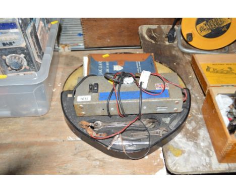 A Jaguar 4.2 Mk10 model operating and maintenance service handbook, a box of tools, and a battery charger 