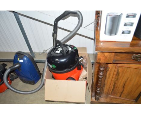 A modern Henry hoover, as new but lacking pipe work
