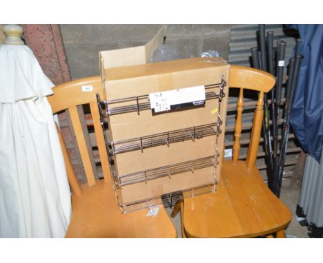 A chrome plated four tier spice rack, as new