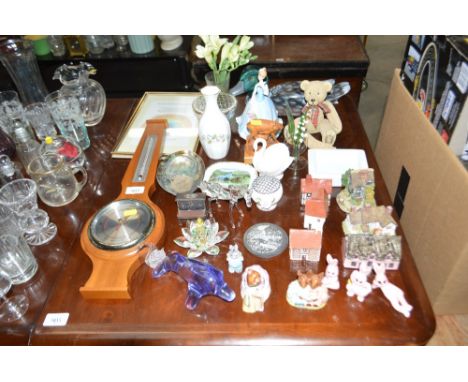 A modern barometer, model houses, various ornaments etc.