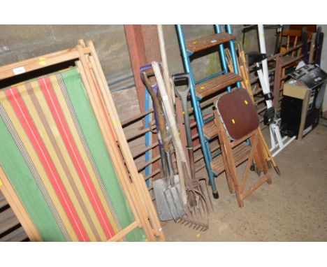 A quantity of long handled garden tools including forks, rake, spade etc. 