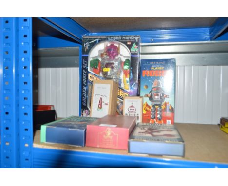 A quantity of boxed toys including a Cyber Hero; mechanical planet robot; wind up racing car etc