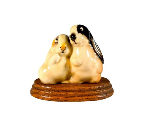 Model no. 249. Hand painted figure depicting two rabbits gazing at each other. Painted in naturalistic coloration. Handwritte