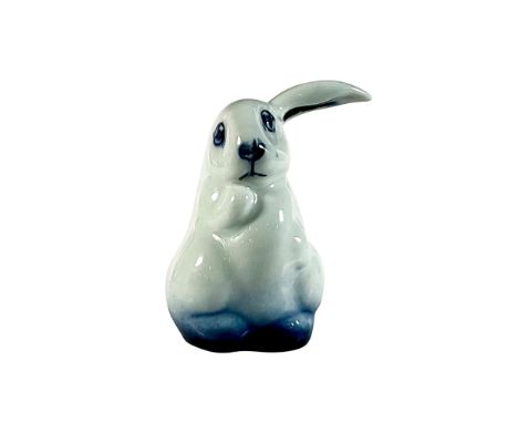 Rare variation; white to blue glaze. Model of a rabbit with big, floppy ears. Flambe backstamp. Dimensions: 2"L x 1.5"W x 2.5