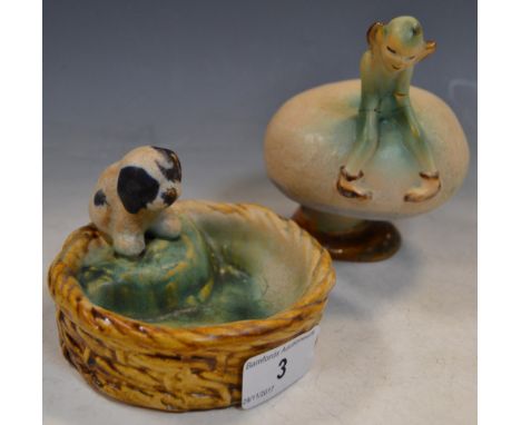 A Denby novelty Gnome on a toadstool, in pastel tones, 11cm high;  another, of a Dog in a basket, 10cm diam (2)