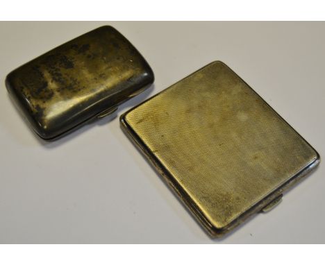 An Edwardian silver bowed rectangular cigarette case, Birmingham 1901;   another (2), 6.3oz 