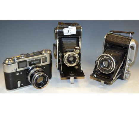 An Ensign 220 Auto-Range bellows camera with original leather case & instructions; a Russian Fed 4 Film Camera With Industar-