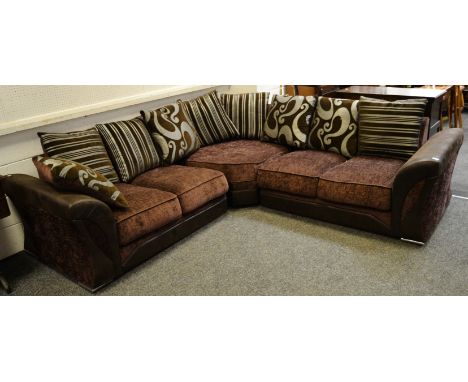 A contemporary corner unit sofa upholstered in needle cord and faux leather