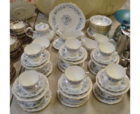 A Colclough china part tea service printed with blue floral sprigs