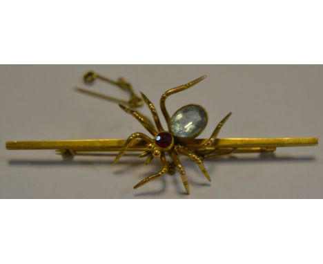 A 9ct gold bar brooch set with an Aqua Marine and Ruby spider
