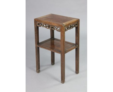 A 19th century Chinese hardwood two-tier occasional table with pierced decoration to the frieze, on square supports with carv