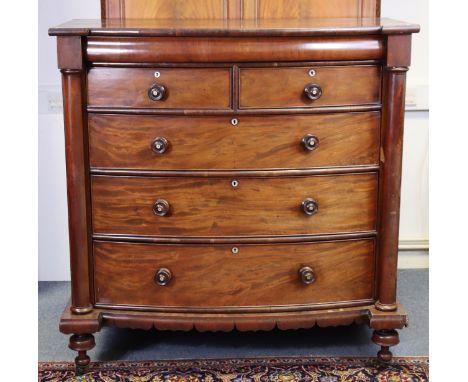 A Victorian mahogany large “Scotch” bow-front chest fitted with a cushion-moulded drawer above two short &amp; three long gra