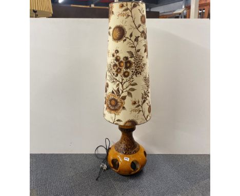 A 1970's German ceramic floor lamp with original shade, H. 130cm.