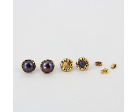 A pair of 9ct gold and pearl earrings, dia. 1cm, with a further pair of 9ct gold stud earrings, one stone missing.