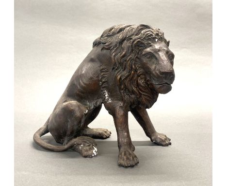 A cast bronze figure of a lion, H. 26cm.