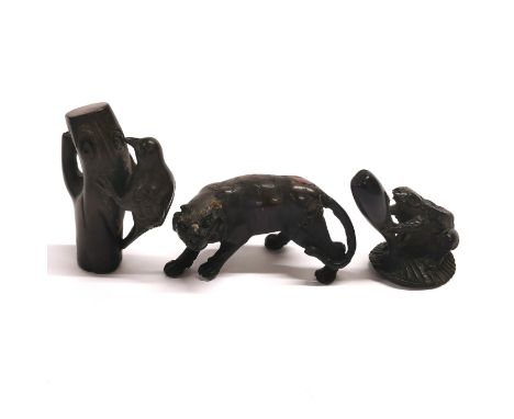 A group of three resin figures.