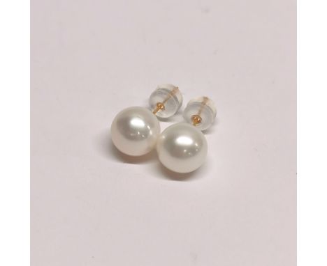 A pair of 18ct gold and large cultured pearl earrings with nylon backs.
