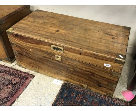 A 19th Century camphor wood trunk with brass corners and embellishments