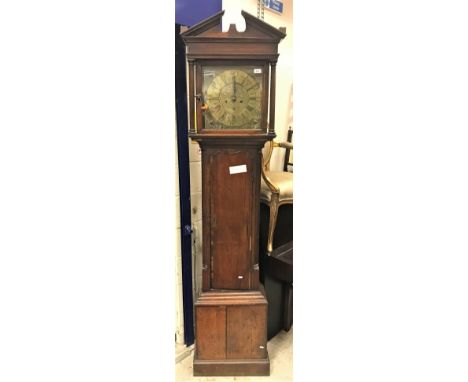 An oak cased long case clock, the eight day movement with square brass dial, the chapter ring with Roman and Arabic numerals 