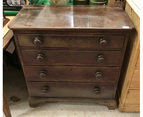 A 19th Century mahogany bachelor's chest, the plain top over a brushing slide and four long drawers with turned knob handles 