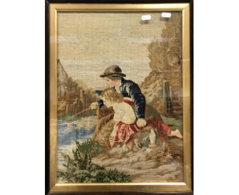 A 19th Century needlework tapestry panel of a young boy and girl fishing, housed in a rosewood veneered frame